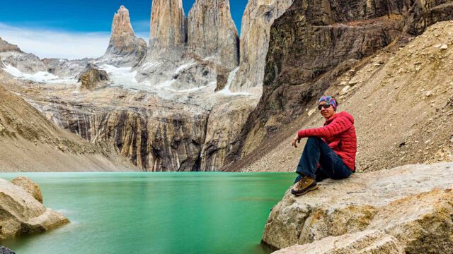 Young adult women resting at Las Torres, Parque national Torres del Paine, Patagonia, Chile.