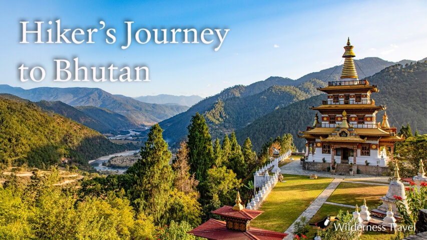 A traditional Bhutanese temple overlooks a lush green valley and river, with forested mountains in the background under a clear blue sky. Text reads, "Hiker’s Journey to Bhutan.