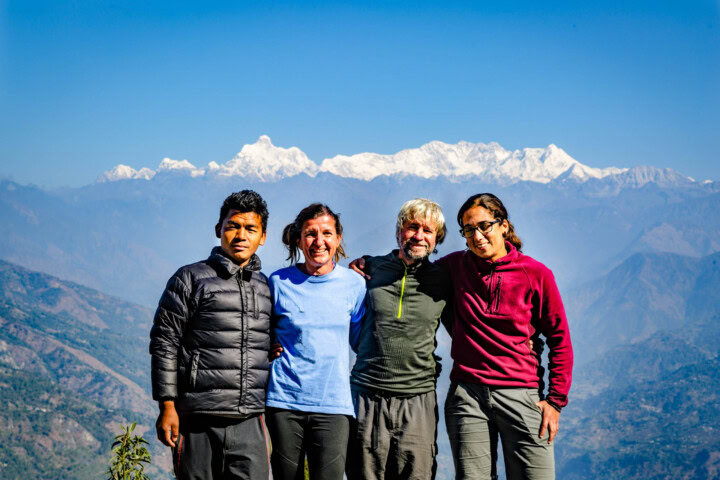 A group of travelers posing for a picture during their trip.