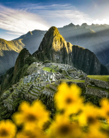 sunrise-machu-picchu-hike-flowers-peru