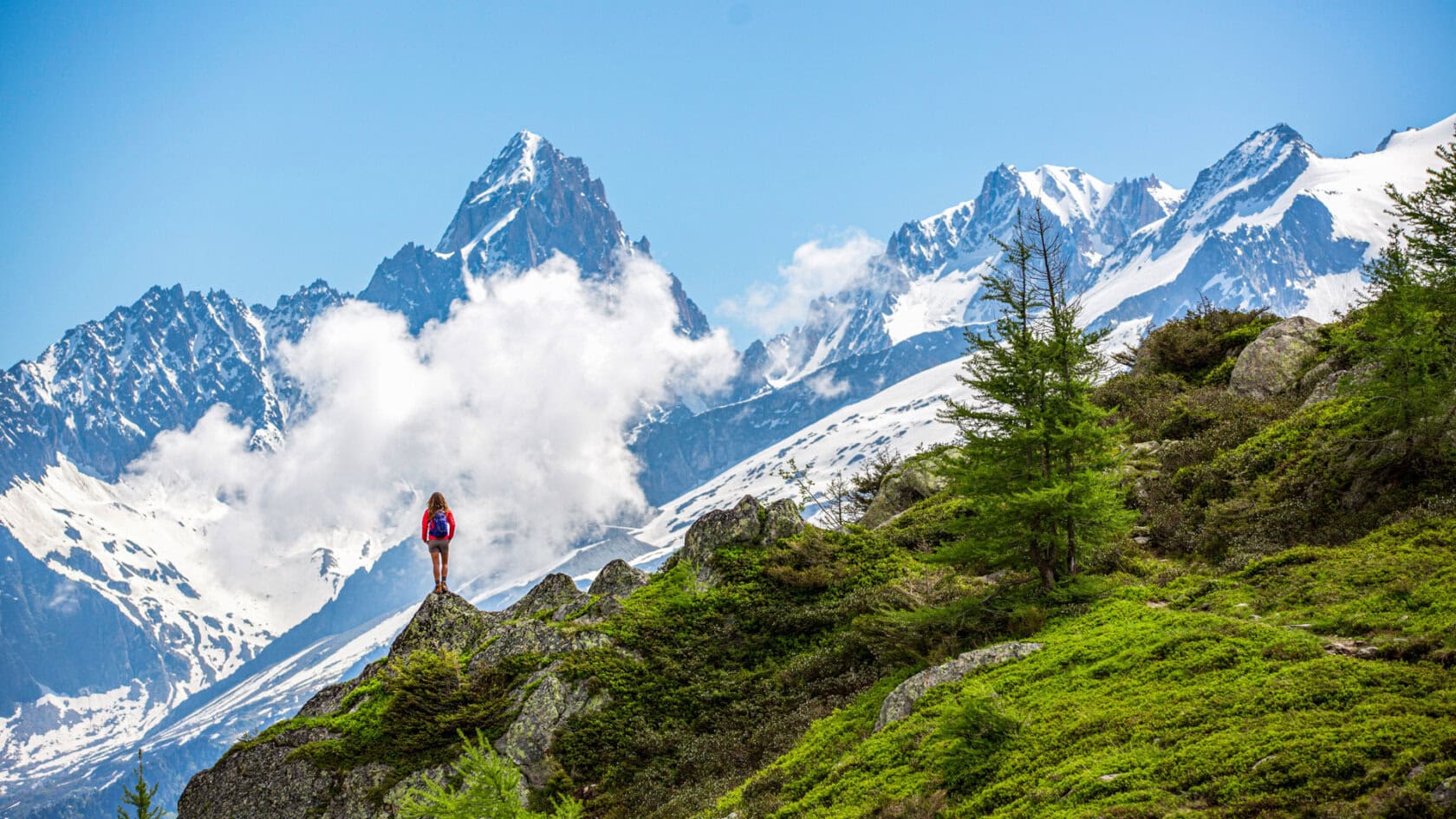 A woman hiking through the French Alps